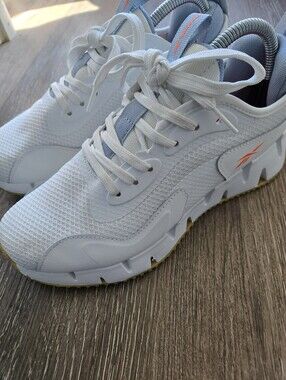 Reebok Women's White Athletic Sneakers with Orange Accent